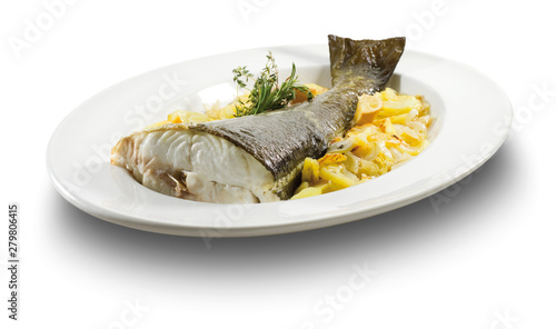 Merluza entera con patatas y cebolla. Whole hake with potatoes and onion photo