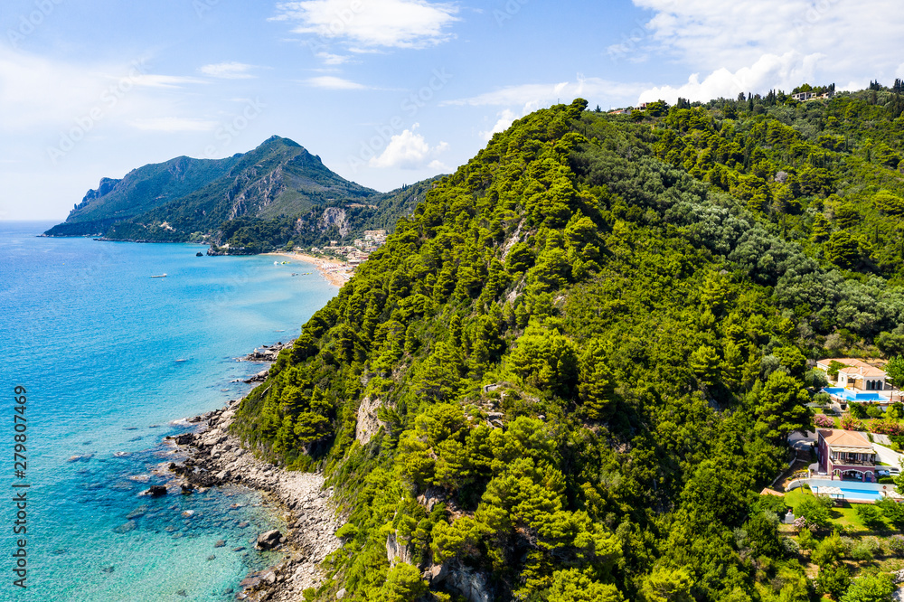 Aerial view of the ocean and beautiful rocks and islands. Summer background of beach, stones seen from above. Aerial view of the ocean and beautiful rocks and islands. Summer background of beach, stones seen from above.