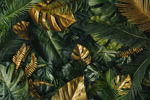 Fototapeta Naklejka Na Ścianę i Meble -  Creative nature background. Gold and green tropical palm leaves. Minimal summer abstract jungle or forest pattern. White paper frame copy space.