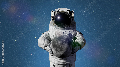 Fototapeta Naklejka Na Ścianę i Meble -  astronaut holding the Moon