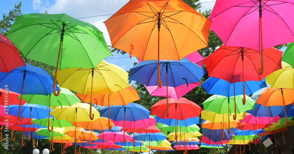colorful umbrellas on a background of blue sky