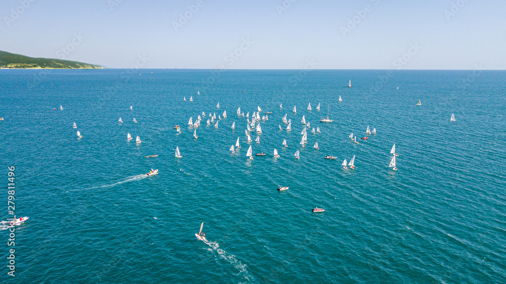 Fototapeta premium Competition on small yachts under sail on the Black Sea in Novorossiysk.