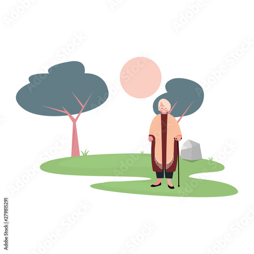 cute grandmother with walk stick in the park