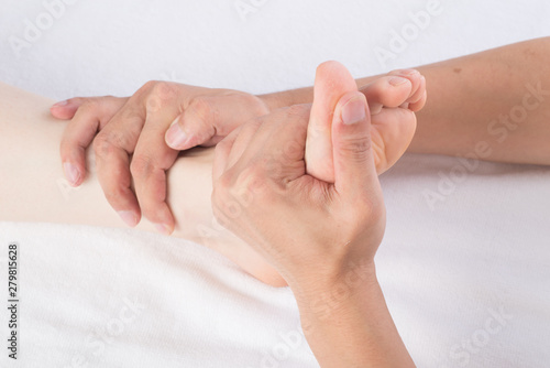 Close-up of female hands doing foot massage