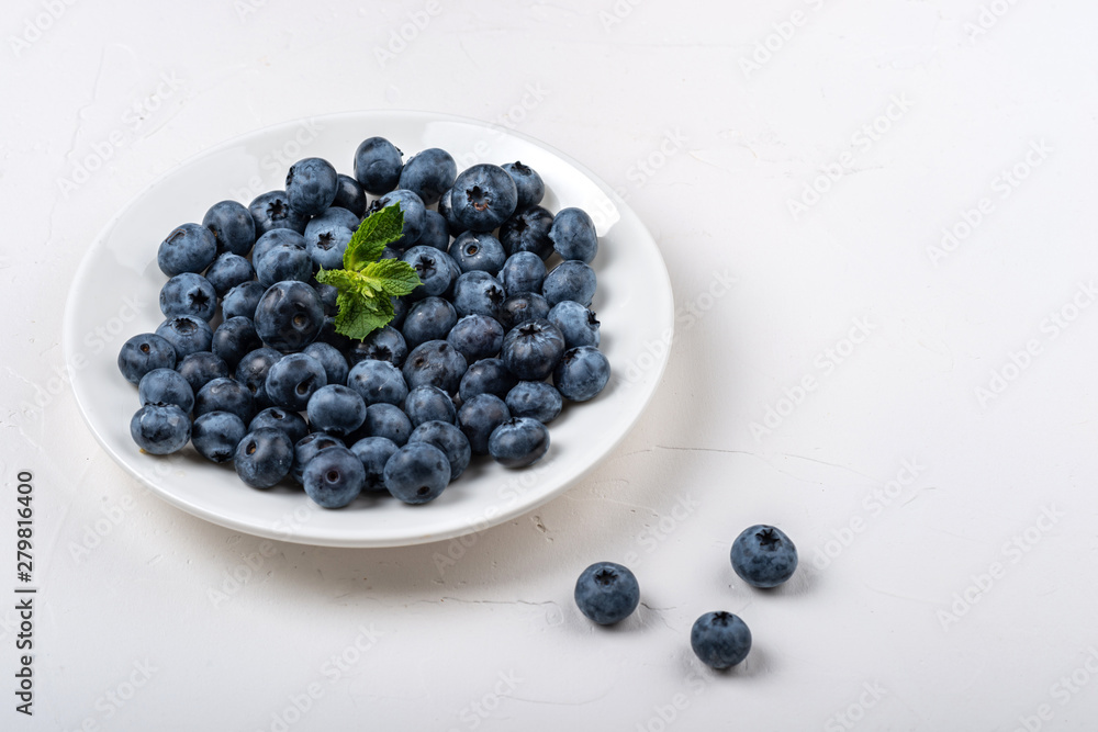 Blueberry plate on white background. Healthy food for breakfast. Blueberry plate on white background. Healthy food for breakfast.
