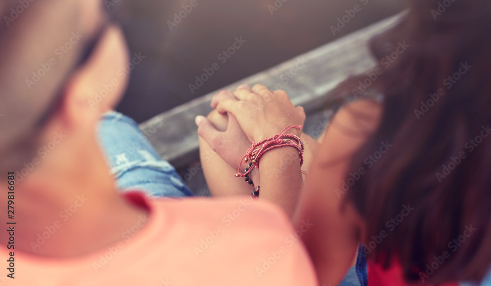 love and people concept - close up of happy teenage couple hands