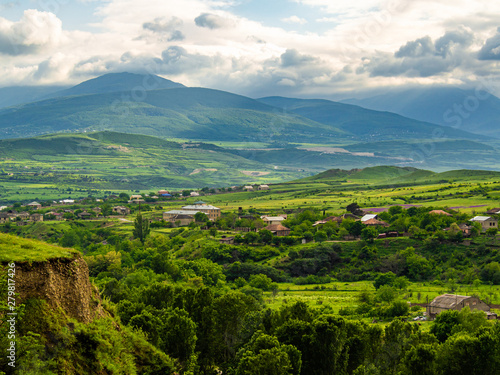 Georgian landscape with village standing at the bank of Ksani river.