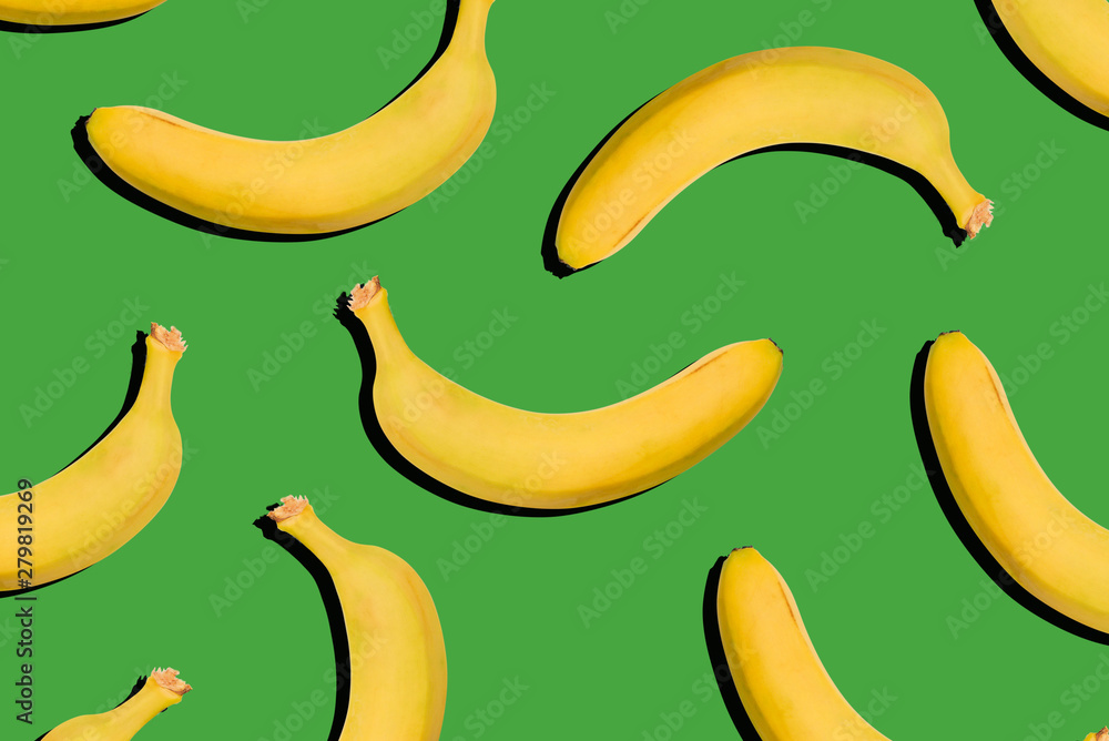 Bananas on a green background. Healthy food, nutrition concept. Creative style, modern art, collage