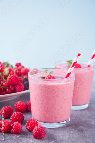 Raspberry smothies and raspberry fruit on the cocreate background