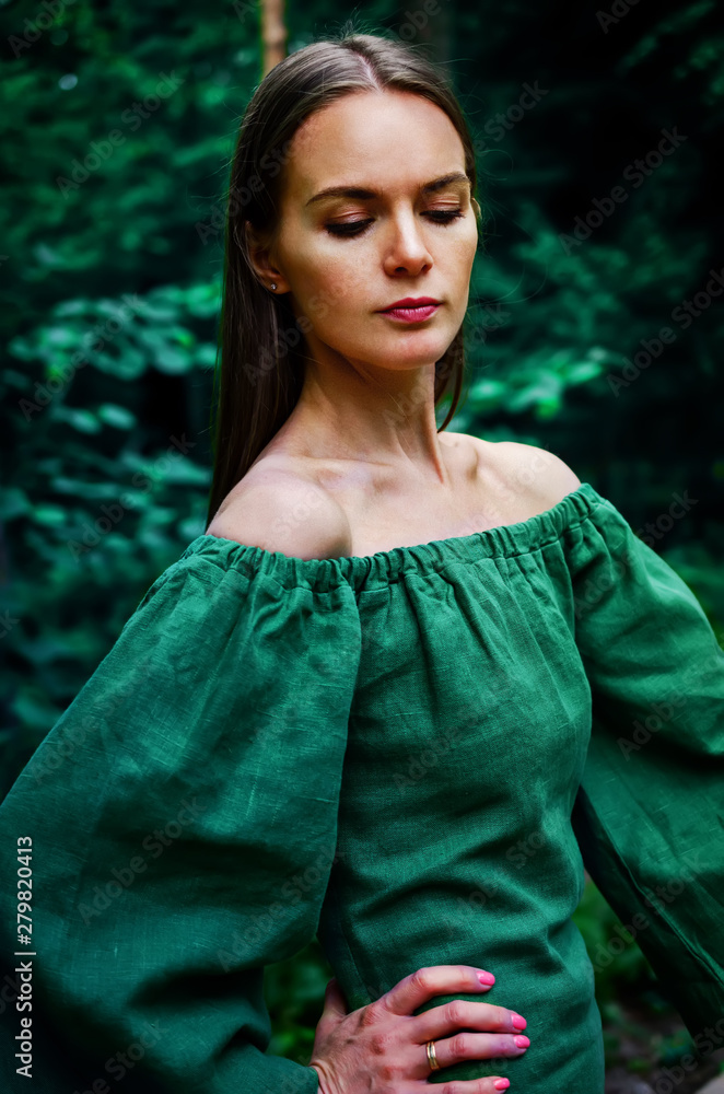 Fototapeta premium Beautiful young woman resting in the park