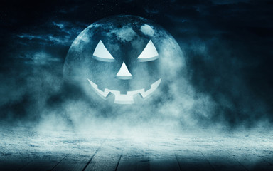Empty dark background. The light of the moon in the forest, moonlight through the trees in the forest. Wooden countertop. Pumpkin, background halloween