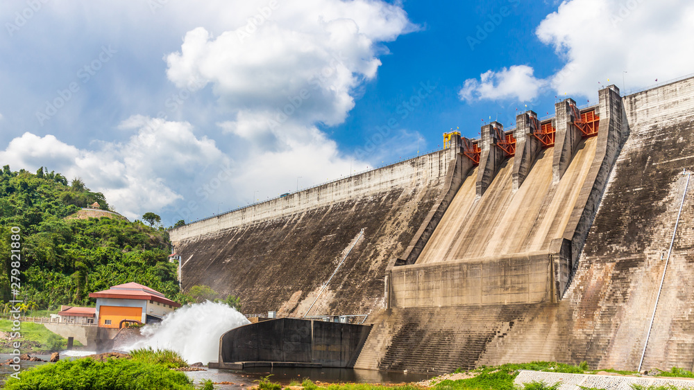 Water storage dam For consumption Large in Nakhon Nayok, Thailand with cloud sky background Water storage dam For consumption Large in Nakhon Nayok, Thailand with cloud sky background
