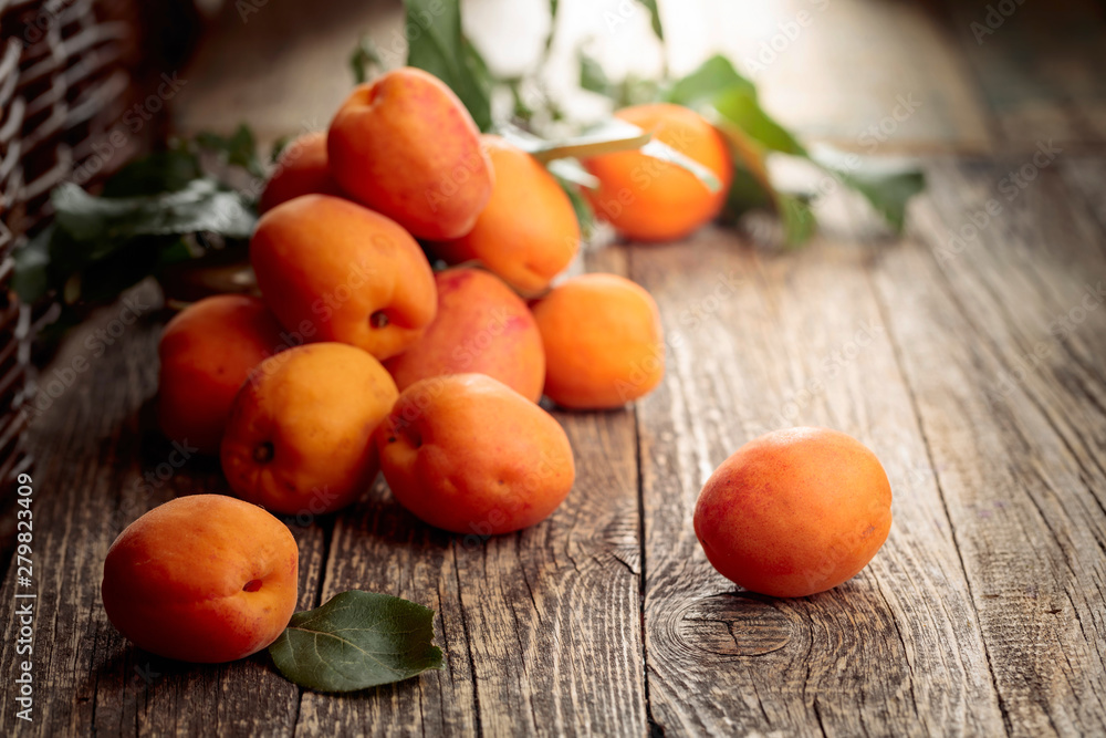 Fresh apricots on a old wooden table.