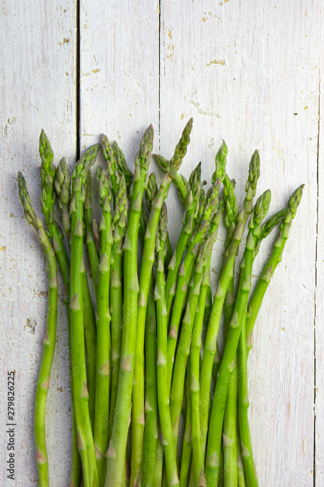 fresh green asparagus on white wooden background fresh green asparagus on white wooden background