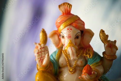 ceramic Ganesha statue altar background 