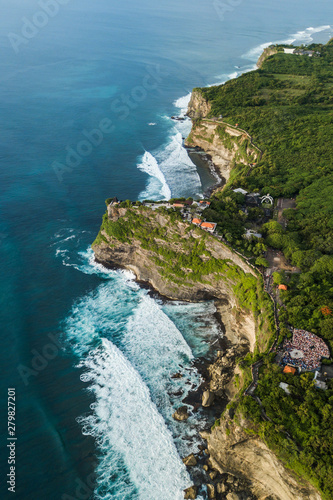Aerial view of Uluwatu temple in Bali, Indonesia. Beautiful balinese landscape with huge waves and rocky ocean shore