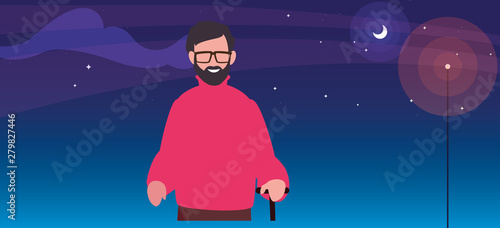 old man with walk stick at night