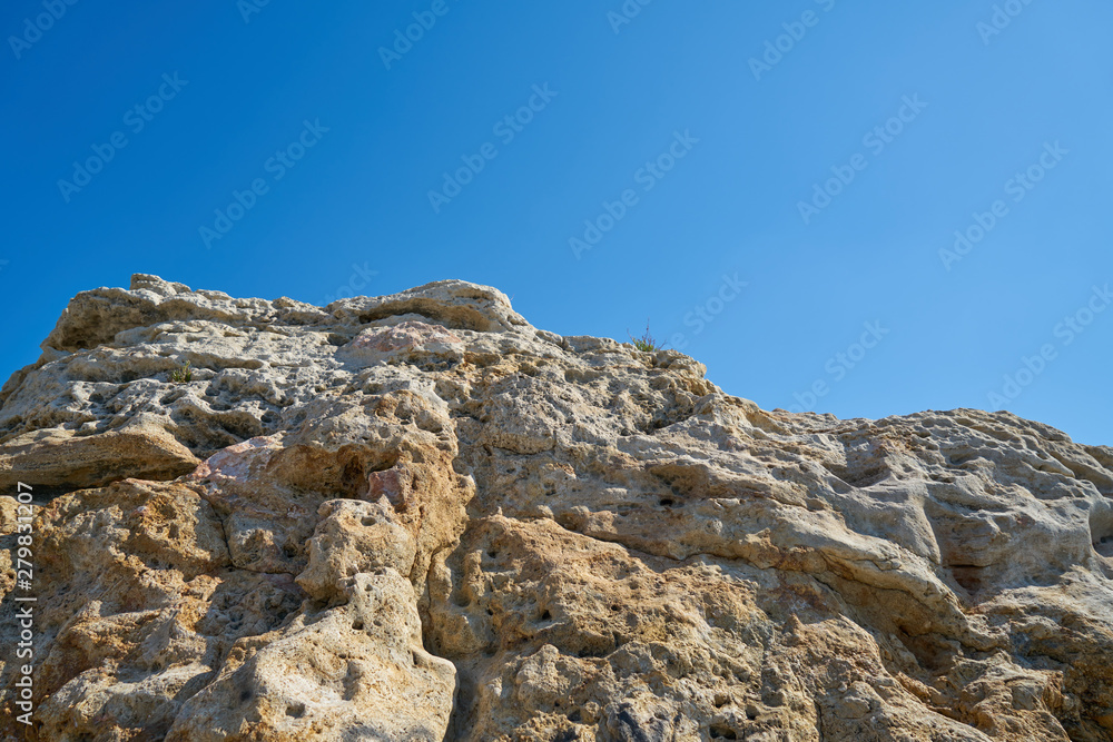 Rock and blue sky background