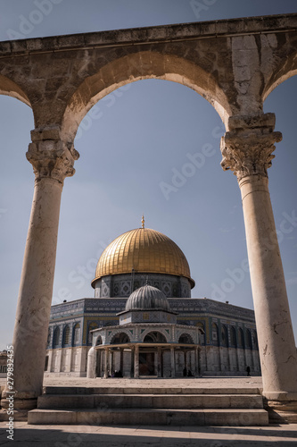 dome of mosque with golden roof in Jerusalem with arc