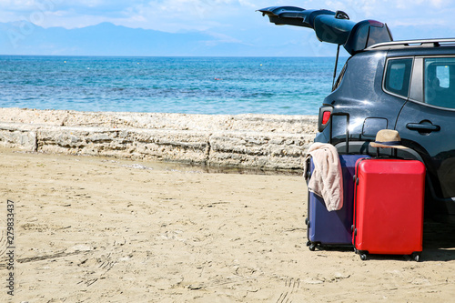 Summer car on a beautiful sunny sandy beach view.