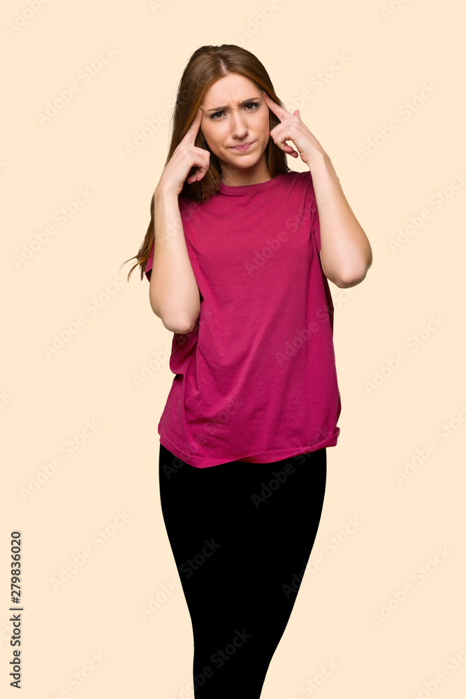 Young redhead girl having doubts and thinking on isolated yellow background Young redhead girl having doubts and thinking on isolated yellow background
