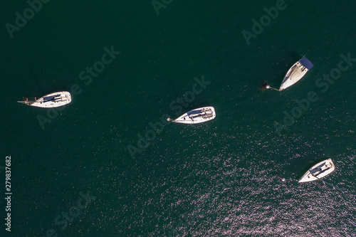 white sailing yachts in the sea top view