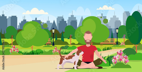 poor bearded man with dog sitting in urban park beggar guy begging for help homeless jobless concept cityscape landscape background full length flat horizontal