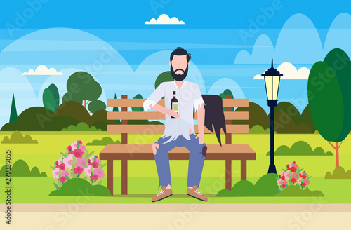 poor man drunk beggar sitting on wooden bench holding bottle of alcohol homeless jobless concept city urban park landscape background full length flat horizontal