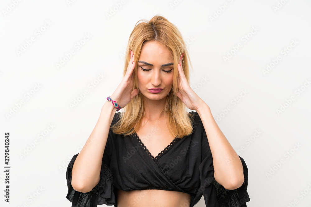 Young blonde woman over isolated white wall with headache Young blonde woman over isolated white wall with headache