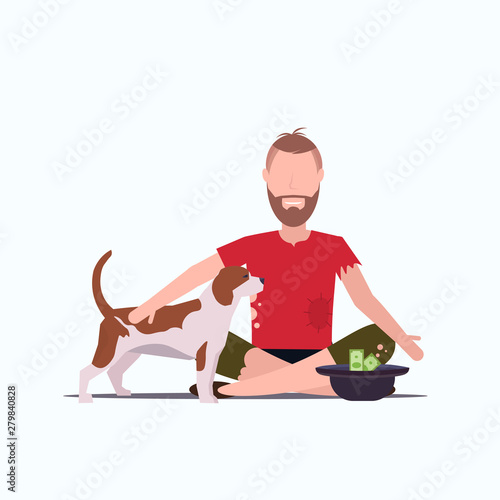 poor bearded man with dog sitting on floor beggar guy begging for money homeless jobless concept white background full length