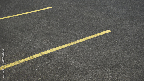 Asphalt Parking Area With Yellow Stripes