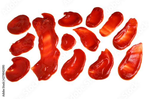 Red sauce splashes isolated on white background. Ketchup.
