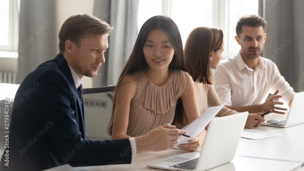 Caucasian male manager mentor teach consult asian female client intern Caucasian male manager mentor teach consult asian female client intern