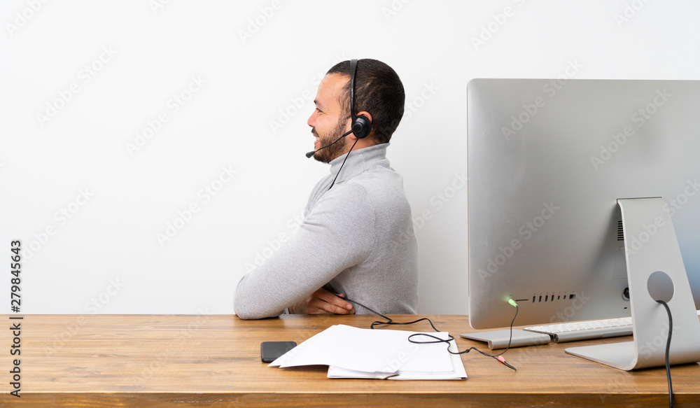 Telemarketer Colombian man in lateral position Telemarketer Colombian man in lateral position