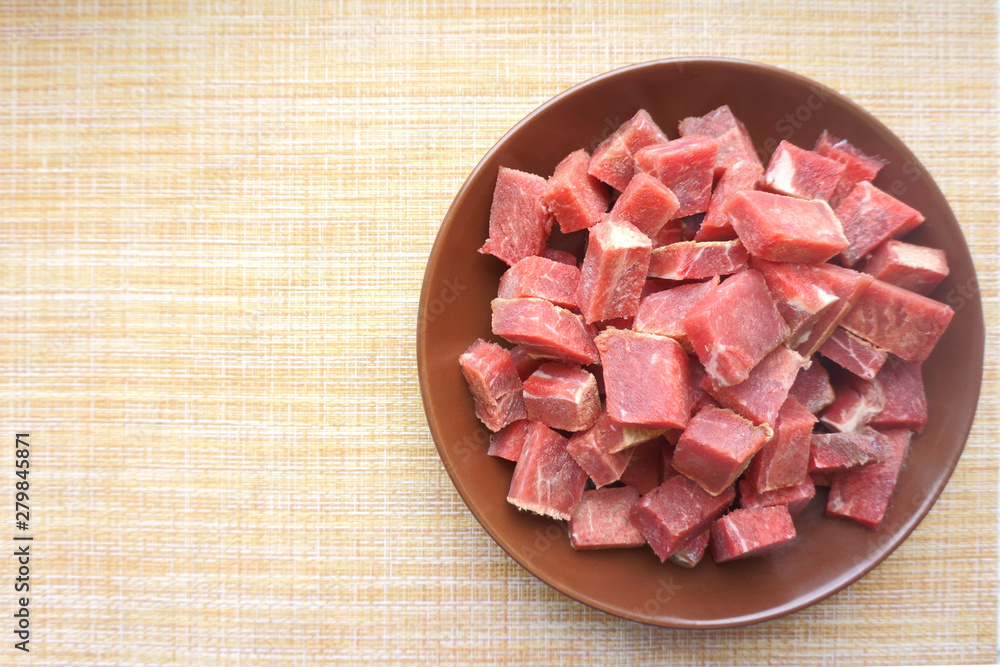 raw beef meat sliced into pieces
