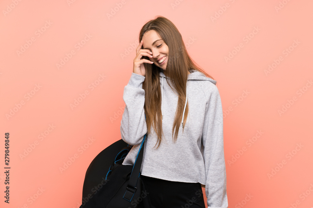Young sport woman over isolated pink background laughing Young sport woman over isolated pink background laughing