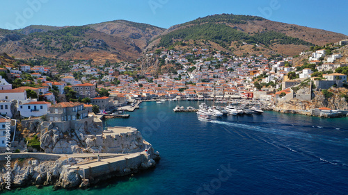 Aerial drone photo of picturesque port and main village of Hydra or Ydra island with beautiful neoclassic houses, Saronic gulf, Greece © aerial-drone