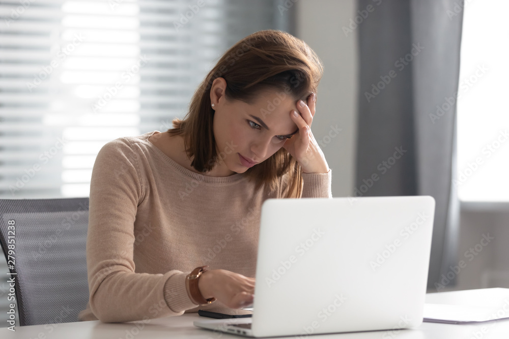 Stressed upset young business woman use laptop doing difficult task Stressed upset young business woman use laptop doing difficult task