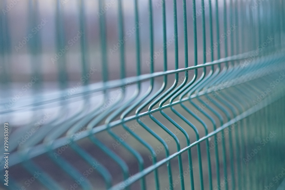 Fototapeta premium Mesh fence. Macro shot. Natural sost background.