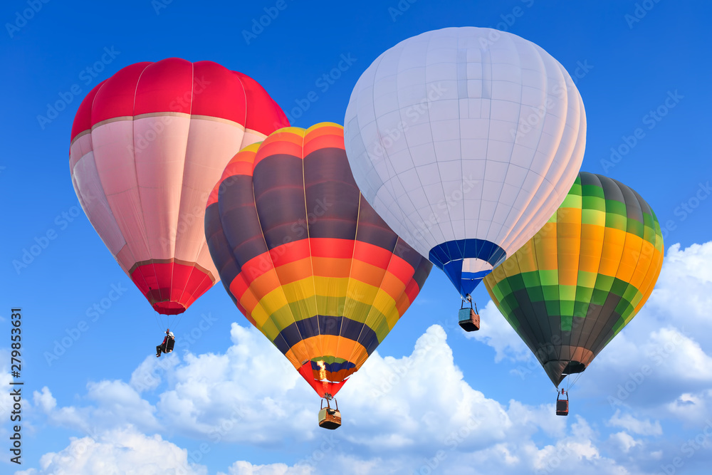 Obraz premium Colorful Hot Air Balloons in Flight over blue sky