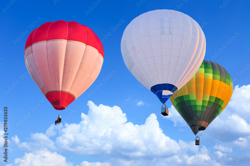 Obraz premium Colorful Hot Air Balloons in Flight over blue sky