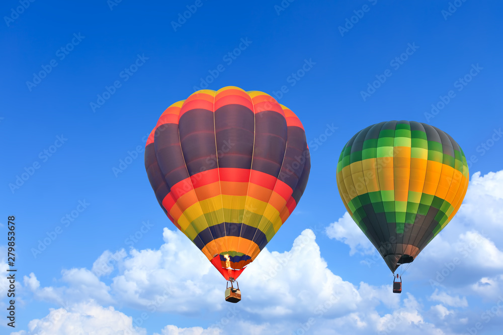 Colorful Hot Air Balloons in Flight over blue sky Colorful Hot Air Balloons in Flight over blue sky