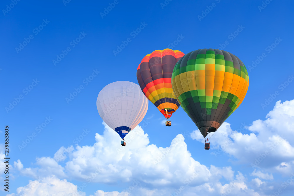Colorful Hot Air Balloons in Flight over blue sky Colorful Hot Air Balloons in Flight over blue sky
