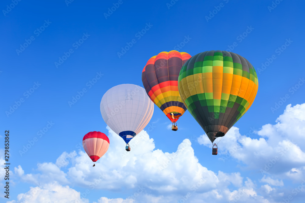 Naklejka premium Colorful Hot Air Balloons in Flight over blue sky