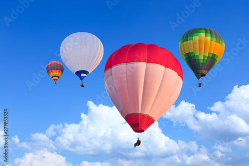 Colorful Hot Air Balloons in Flight over blue sky © shahrilkhmd