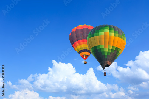 Colorful Hot Air Balloons in Flight over blue sky