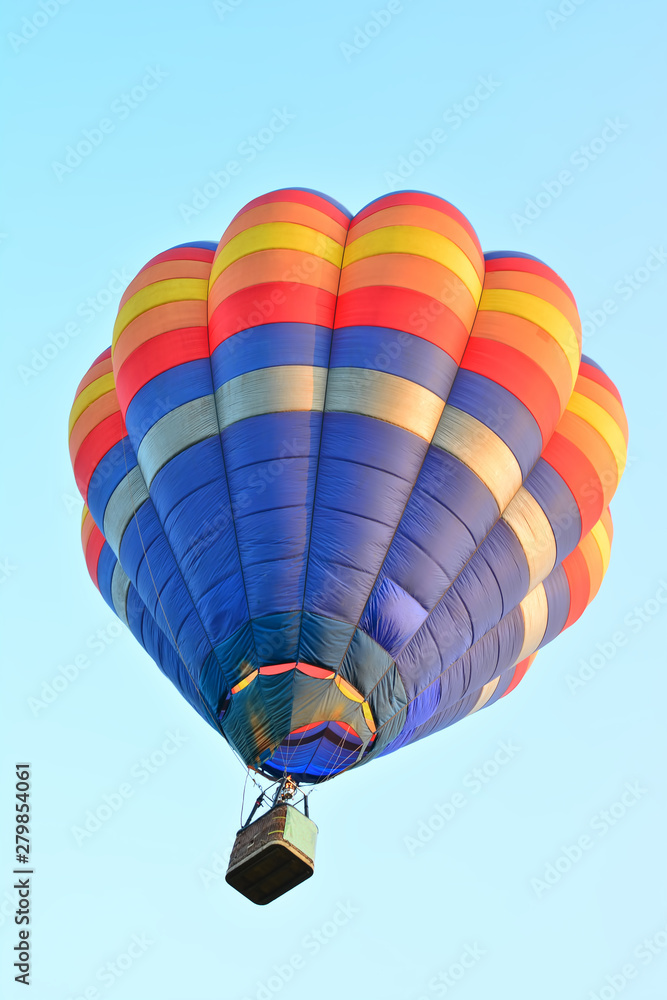Obraz premium Colorful Hot Air Balloons in Flight over blue sky