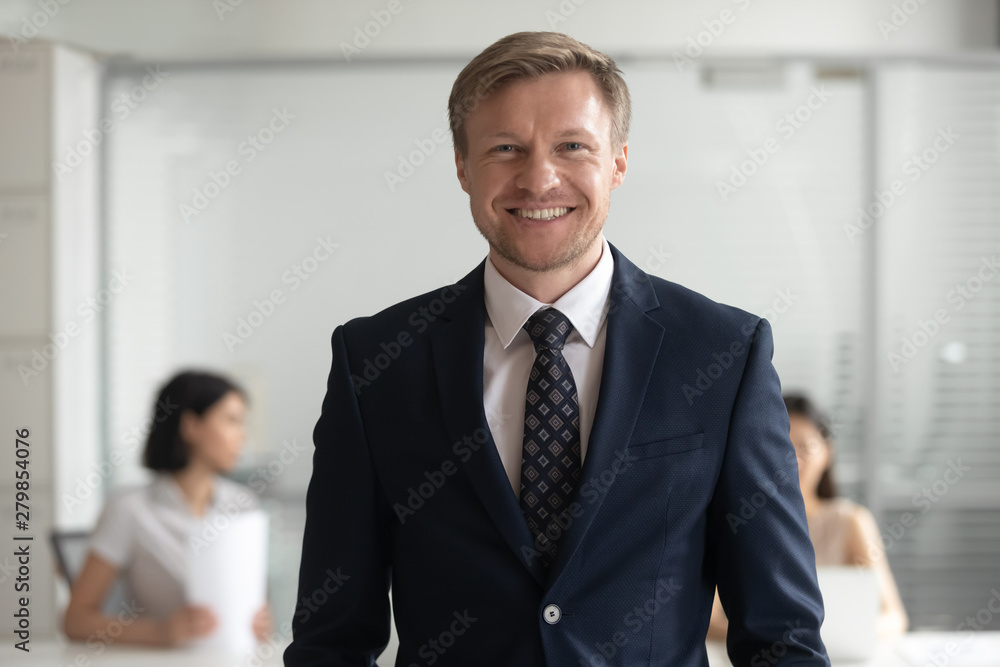 Confident smiling business man banker in suit looking at camera Confident smiling business man banker in suit looking at camera