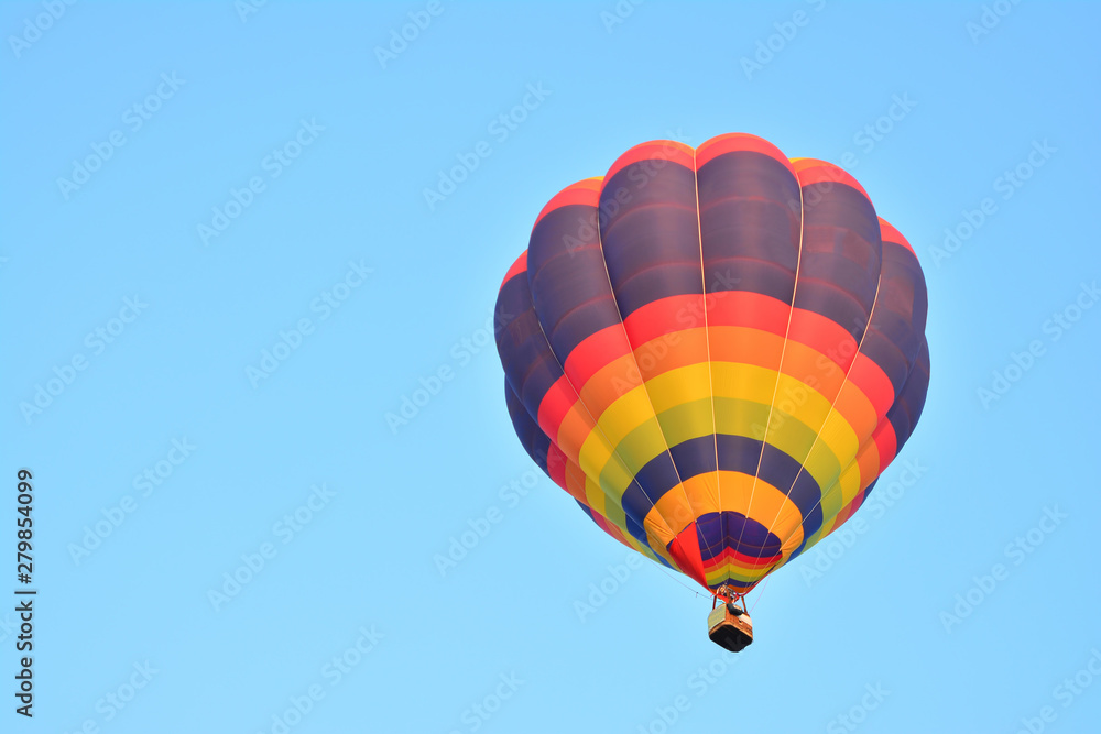 Colorful Hot Air Balloons in Flight over blue sky Colorful Hot Air Balloons in Flight over blue sky