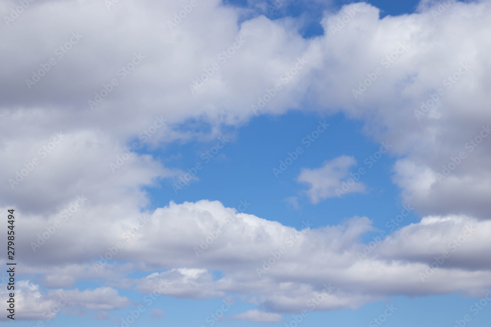 Blue sky with clouds. A piece of blue sky in the clouds Blue sky with clouds. A piece of blue sky in the clouds